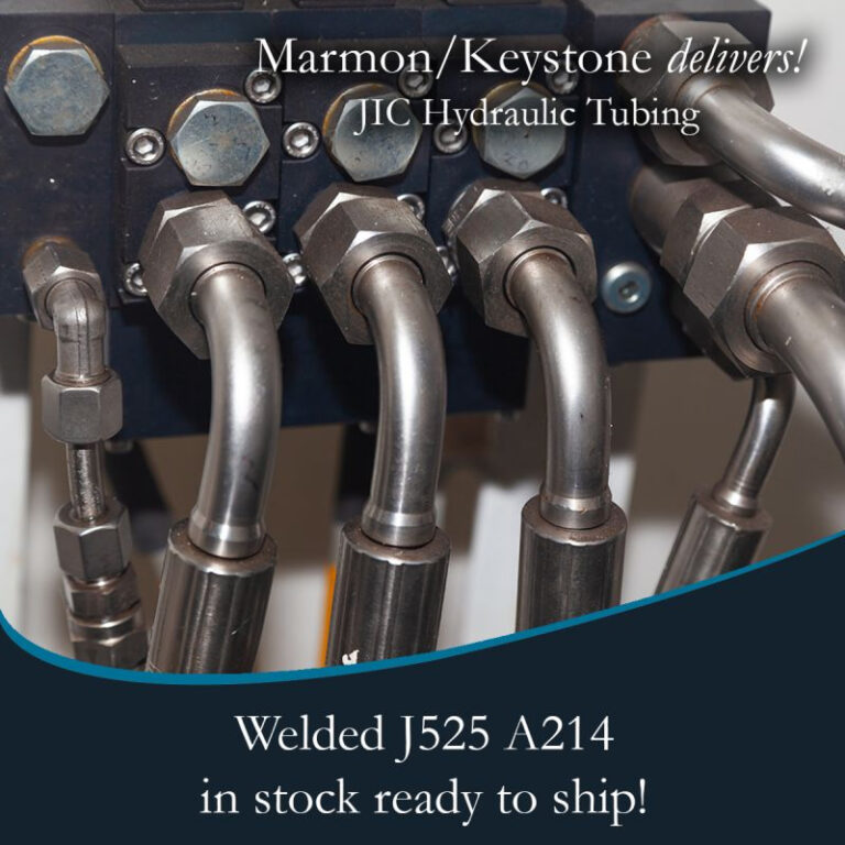 Marmon Keystone Close-up view of metal hydraulic tubes connected to fittings, highlighting Marmon/Keystone as your trusted metals distributor for JIC hydraulic tubing—welded J525 A214—available in stock and ready to ship for your supplychain needs.