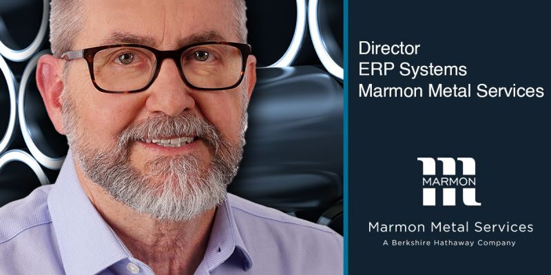 Marmon Keystone A man with glasses and a beard is smiling in front of a metallic, circular patterned background. Text reads: "Brad McQueen, Director ERP Systems, Marmon Metal Services—leading metals supply chain. Promotion earned! Marmon Metal Services logo included.